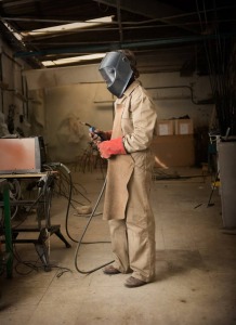 man in a welding suit