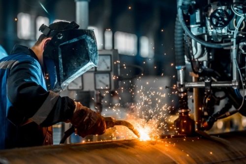 man doing some metal work